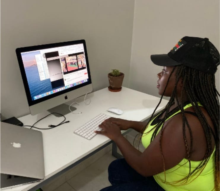 An editor at work on an iMac